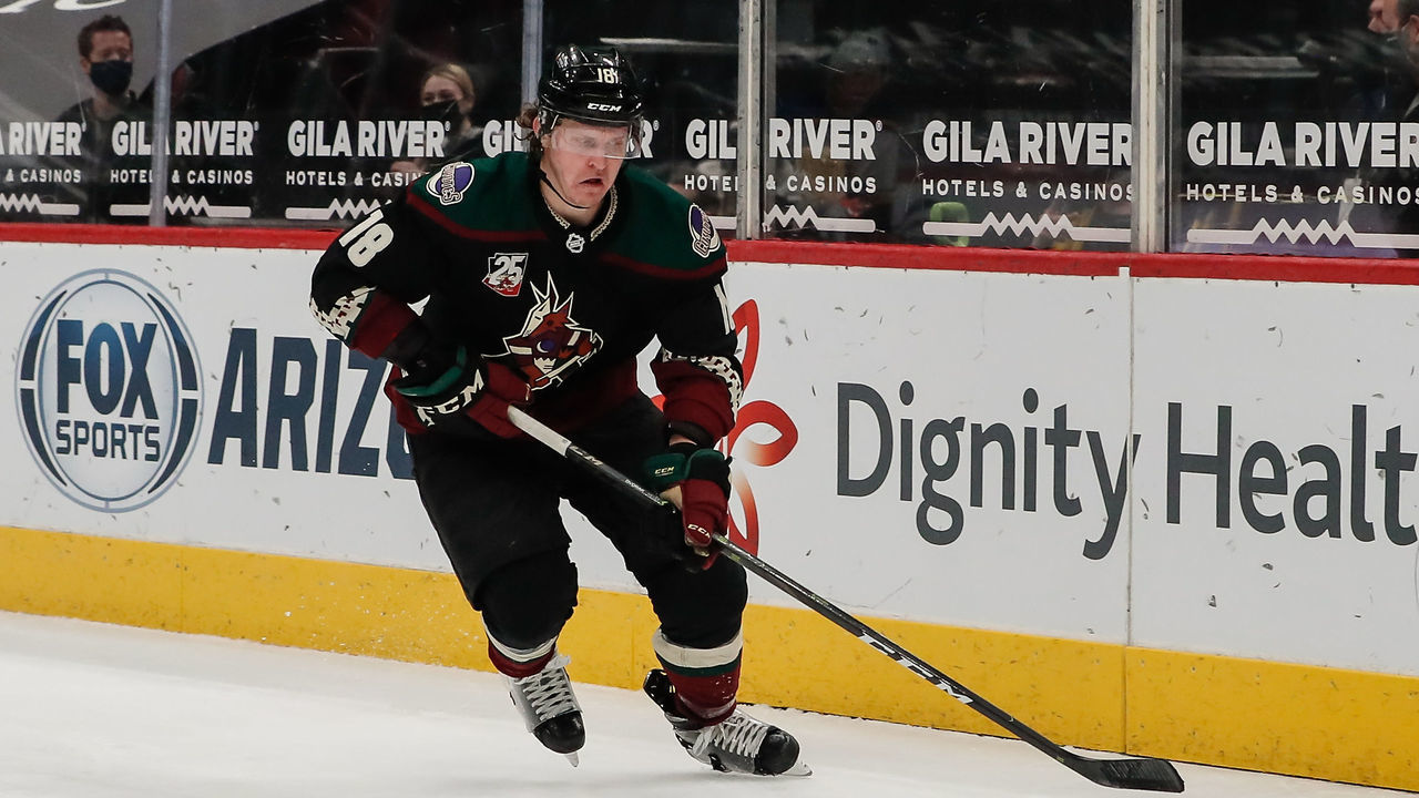 GLENDALE, AZ - FEBRUARY 15: Arizona Coyotes center Christian Dvorak (18) skates with the puck during the NHL hockey game between the St. Louis Blues and the Arizona Coyotes on February 15, 2021 at Gila River Arena in Glendale, Arizona.