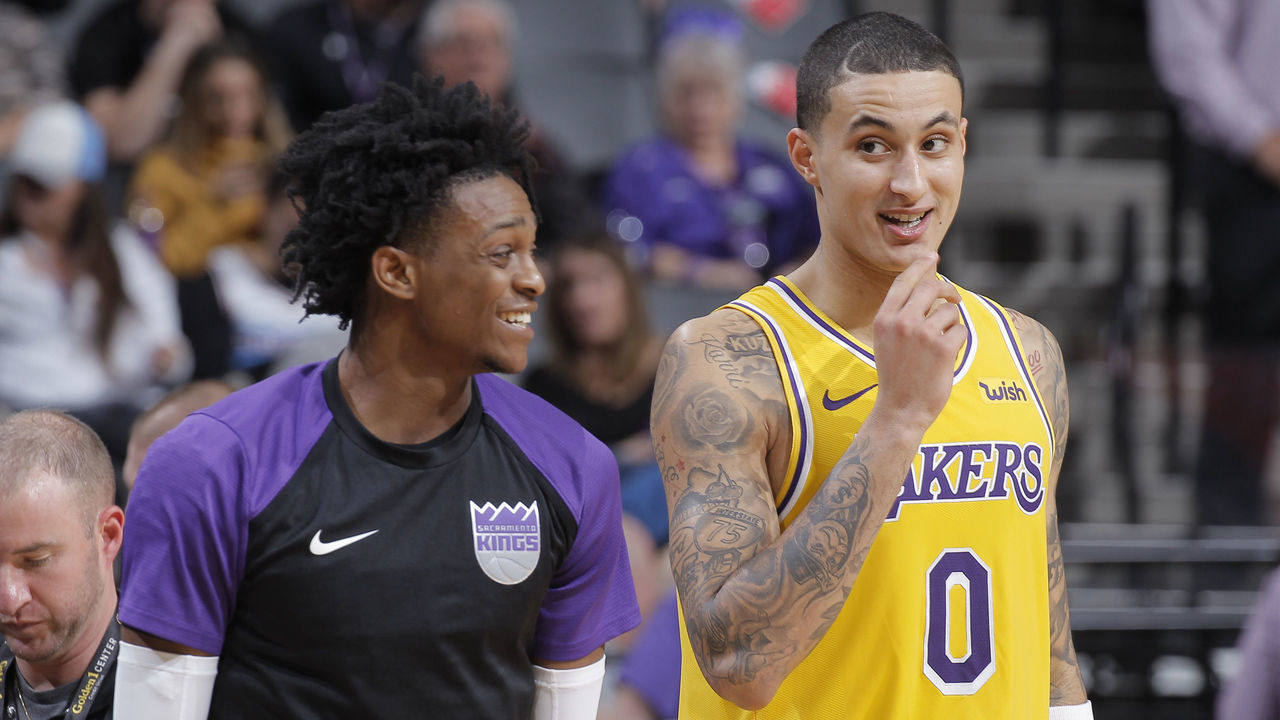 SACRAMENTO, CA - DECEMBER 27: Kyle Kuzma #0 of the Los Angeles Lakers talks to De'Aaron Fox #5 of the Sacramento Kings on December 27, 2018 at Golden 1 Center in Sacramento, California. NOTE TO USER: User expressly acknowledges and agrees that, by downloading and or using this photograph, User is consenting to the terms and conditions of the Getty Images Agreement. Mandatory Copyright Notice: Copyright 2018 NBAE