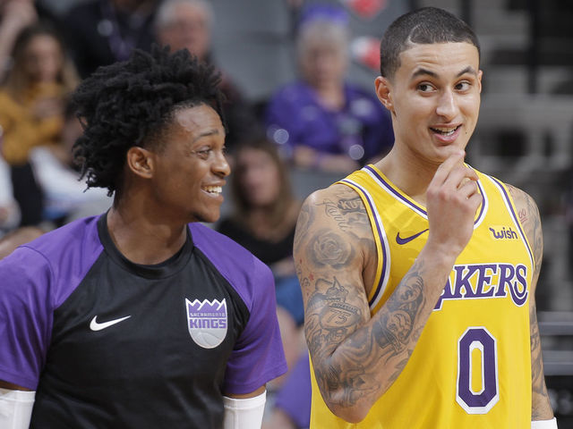 SACRAMENTO, CA - DECEMBER 27: Kyle Kuzma #0 of the Los Angeles Lakers talks to De'Aaron Fox #5 of the Sacramento Kings on December 27, 2018 at Golden 1 Center in Sacramento, California. NOTE TO USER: User expressly acknowledges and agrees that, by downloading and or using this photograph, User is consenting to the terms and conditions of the Getty Images Agreement. Mandatory Copyright Notice: Copyright 2018 NBAE