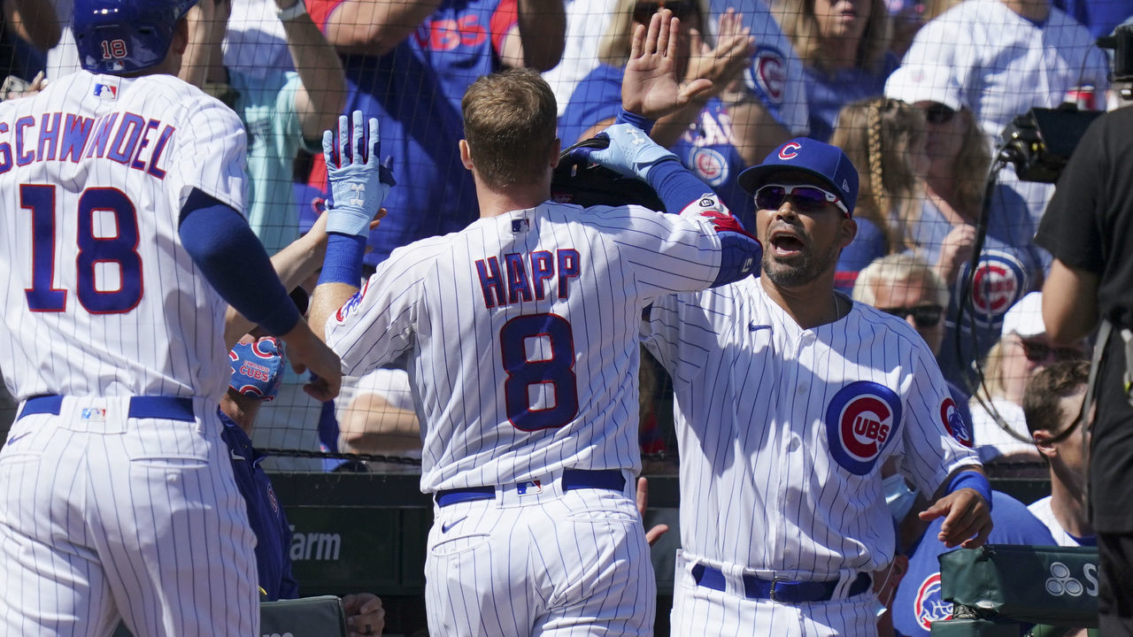 CHICAGO, ILLINOIS - SEPTEMBER 06: Ian Happ #8 of the Chicago Cubs is congratulated by Robinson Chirinos #29 following his three-run home run during the first inning of a game against the Cincinnati Reds at Wrigley Field on September 06, 2021 in Chicago, Illinois.
