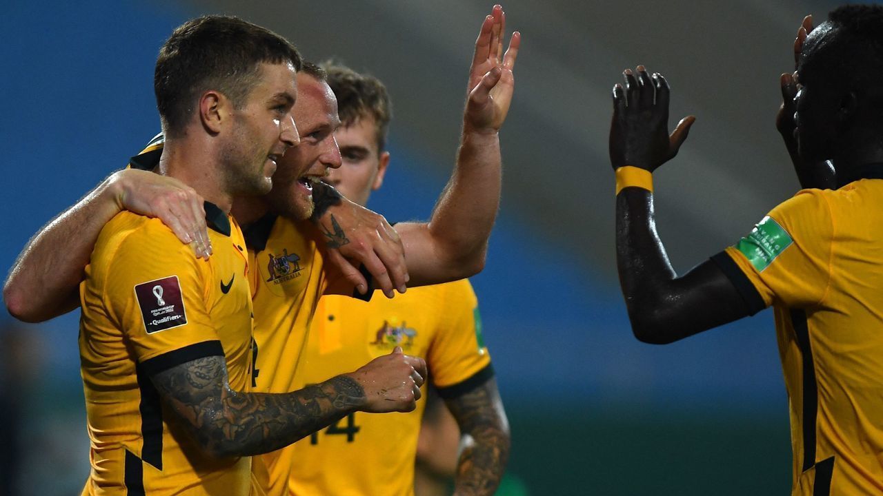 Australia's defender Rhyan Grant (2nd L) reacts with teammates after scoring during the FIFA World Cup Qatar 2022 qualifying round Group B football match between Australia and Vietnam at the My Dinh National Stadium in Hanoi on September 7, 2021.
