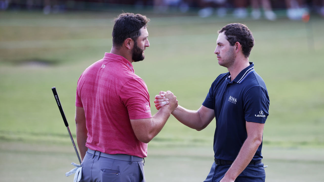 ATLANTA, GEORGIA - SEPTEMBER 05: Jon Rahm of Spain congratulates Patrick Cantlay of the United States on the 18th green after Cantlay won during the final round of the TOUR Championship at East Lake Golf Club on September 05, 2021 in Atlanta, Georgia.