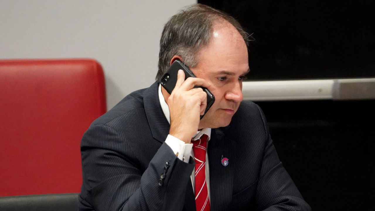 KANATA, ON - OCTOBER 06: General manager Pierre Dorion of the Ottawa Senators sits at the draft table during the first round of the 2020 NHL Entry Draft at Canadian Tire Centre on October 06, 2020 in Kanata, Ontario, Canada. The 2020 NHL Draft was held virtually due to the ongoing Coronavirus pandemic.
