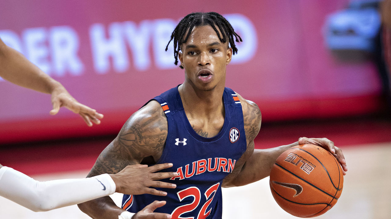 FAYETTEVILLE, ARKANSAS - JANUARY 20: Allen Flanigan #22 of the Auburn Tigers runs the offense during a game against the Arkansas Razorbacks at Bud Walton Arena on January 20, 2021 in Fayetteville, Arkansas. The Razorbacks defeated the Tigers 75-73.