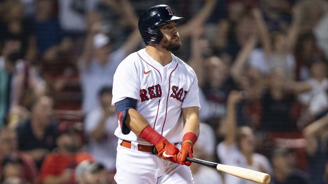 BOSTON, MA - AUGUST 25: Kyle Schwarber #18 of the Boston Red Sox hits a game-tying two run home run during the ninth inning of a game against the Minnesota Twins on August 25, 2021 at Fenway Park in Boston, Massachusetts.