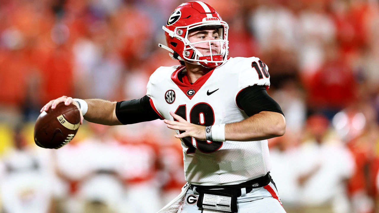 CHARLOTTE, NORTH CAROLINA - SEPTEMBER 04: JT Daniels #18 of the Georgia Bulldogs drops back to pass against the Clemson Tigers during the first half of the Duke's Mayo Classic at Bank of America Stadium on September 04, 2021 in Charlotte, North Carolina.