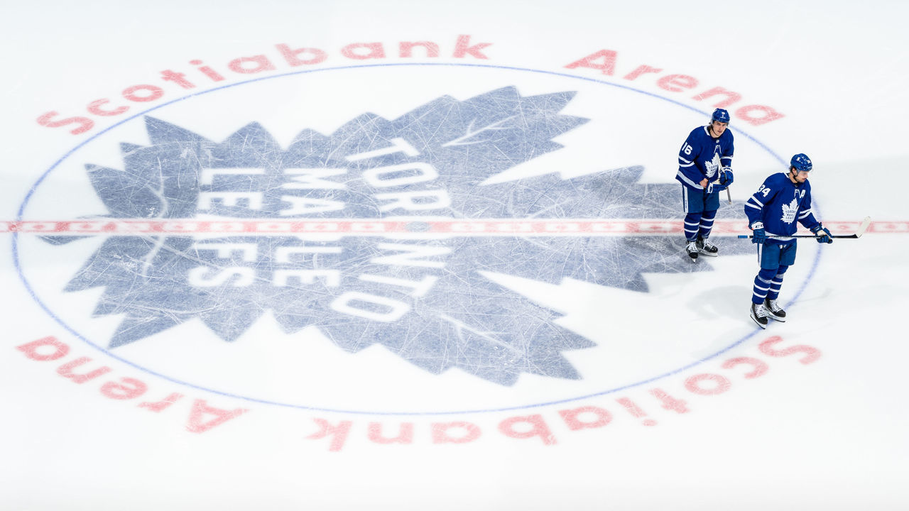 TORONTO, ON - MAY 8: Mitchell Marner #16 of the Toronto Maple Leafs and Auston Matthews #34 skate over the logo at centre ice at an NHL game against the Montreal Canadiens during the second period at the Scotiabank Arena on May 8, 2021 in Toronto, Ontario, Canada.