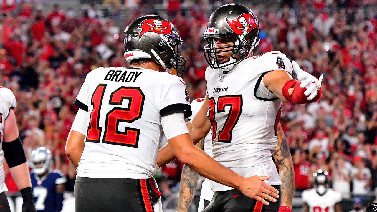 TAMPA, FLORIDA - SEPTEMBER 09: Tom Brady #12 and Rob Gronkowski #87 of the Tampa Bay Buccaneers celebrate a touchdown during the second quarter against the Dallas Cowboys at Raymond James Stadium on September 09, 2021 in Tampa, Florida.