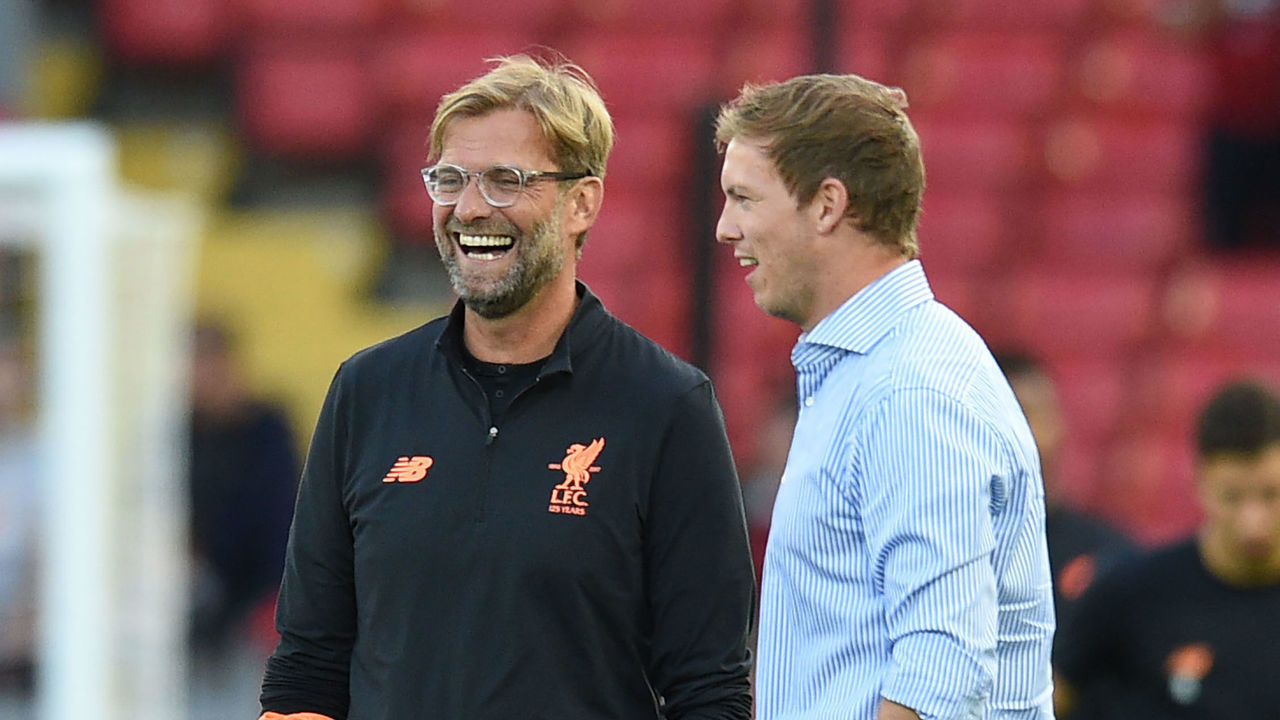 Hoffenheim's manager Julian Nagelsmann (R) and Liverpool's German manager Jurgen Klopp chat prior to the Champions League qualifier, second leg match between Liverpool and Hoffenheim at Anfield stadium in Liverpool on August 23, 2017. / AFP PHOTO / Oli SCARFF