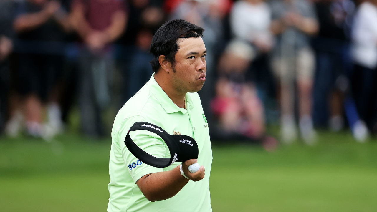 VIRGINIA WATER, ENGLAND - SEPTEMBER 10: Kiradech Aphibarnrat of Thailand acknowledges the crowd after finishing his round on the 18th hole during Day Two of The BMW PGA Championship at Wentworth Golf Club on September 10, 2021 in Virginia Water, England.