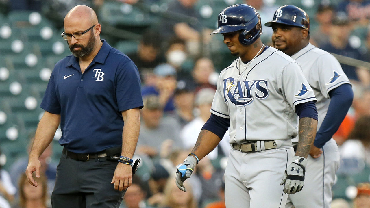 DETROIT, MI - SEPTEMBER 10: Wander Franco #5 of the Tampa Bay Rays leaves the game against the Detroit Tigers with a trainer during the first inning at Comerica Park on September 10, 2021, in Detroit, Michigan.