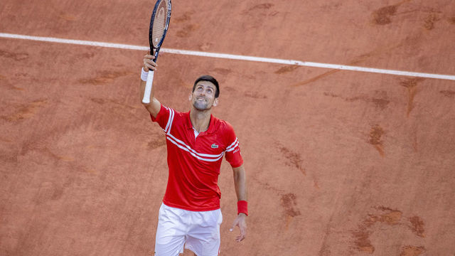 PARIS, FRANCE June 13. Novak Djokovic of Serbia celebrates his victory against Stefanos Tsitsipas of Greece on Court Philippe-Chatrier during the Men's Singles Final at the 2021 French Open Tennis Tournament at Roland Garros on June 13th 2021 in Paris, France.