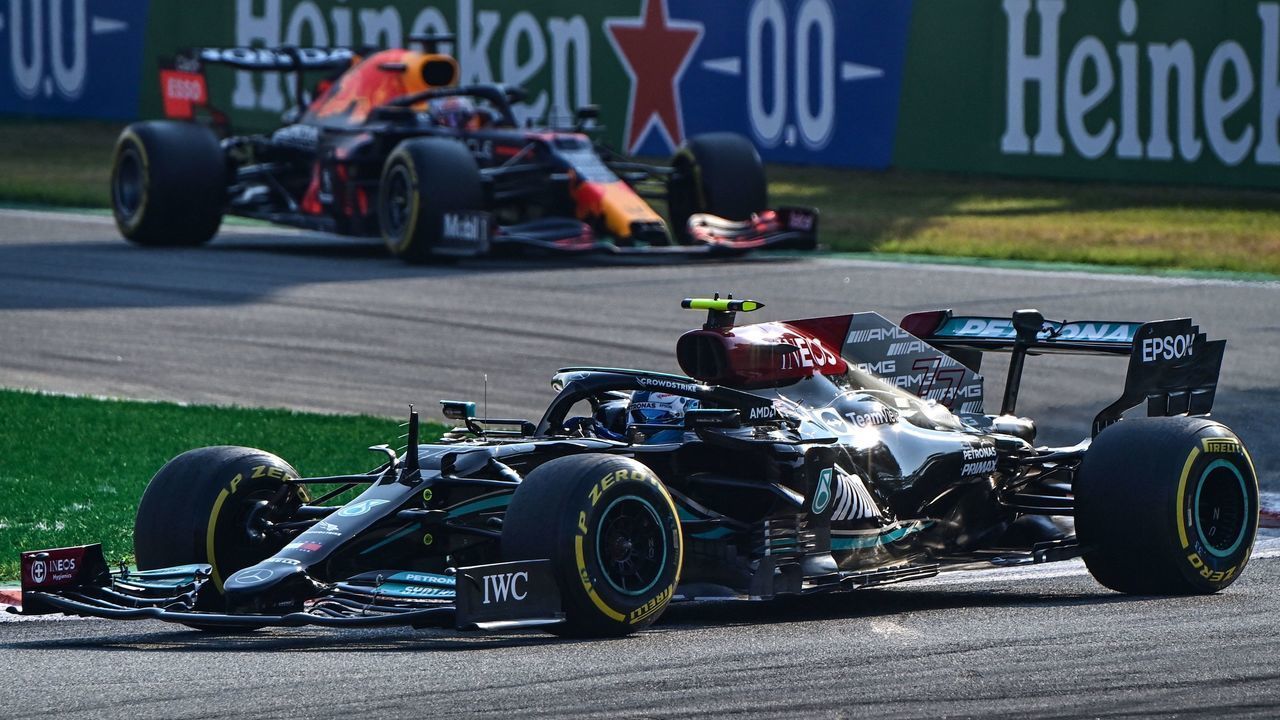 Mercedes' Finnish driver Valtteri Bottas drives ahead of Red Bull's Dutch driver Max Verstappen during the sprint session at the Autodromo Nazionale circuit in Monza, on September 11, 2021, ahead of the Italian Formula One Grand Prix.