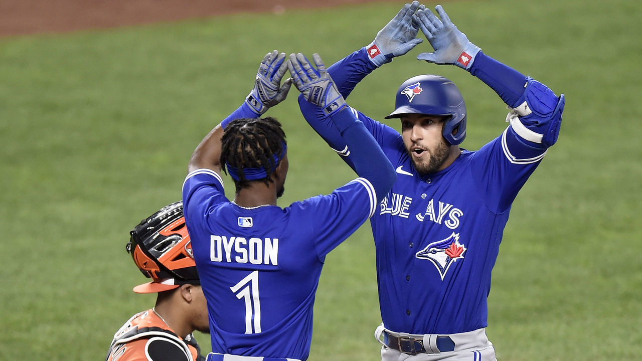 BALTIMORE, MARYLAND - SEPTEMBER 11: George Springer #4 of the Toronto Blue Jays celebrates with Jarrod Dyson #1 after hitting a go-head two-run home run in the seventh inning against the Baltimore Orioles during game one of a doubleheader at Oriole Park at Camden Yards on September 11, 2021 in Baltimore, Maryland.