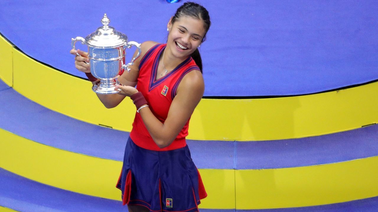 Britain's Emma Raducanu celebrates with the trophy after winning the 2021 US Open Tennis tournament women's final match against Canada's Leylah Fernandez at the USTA Billie Jean King National Tennis Center in New York, on September 11, 2021.