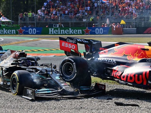 Mercedes' British driver Lewis Hamilton (L) reacts in his car following a collision with Red Bull's Dutch driver Max Verstappen (unseen) during the Italian Formula One Grand Prix at the Autodromo Nazionale circuit in Monza, on September 12, 2021.