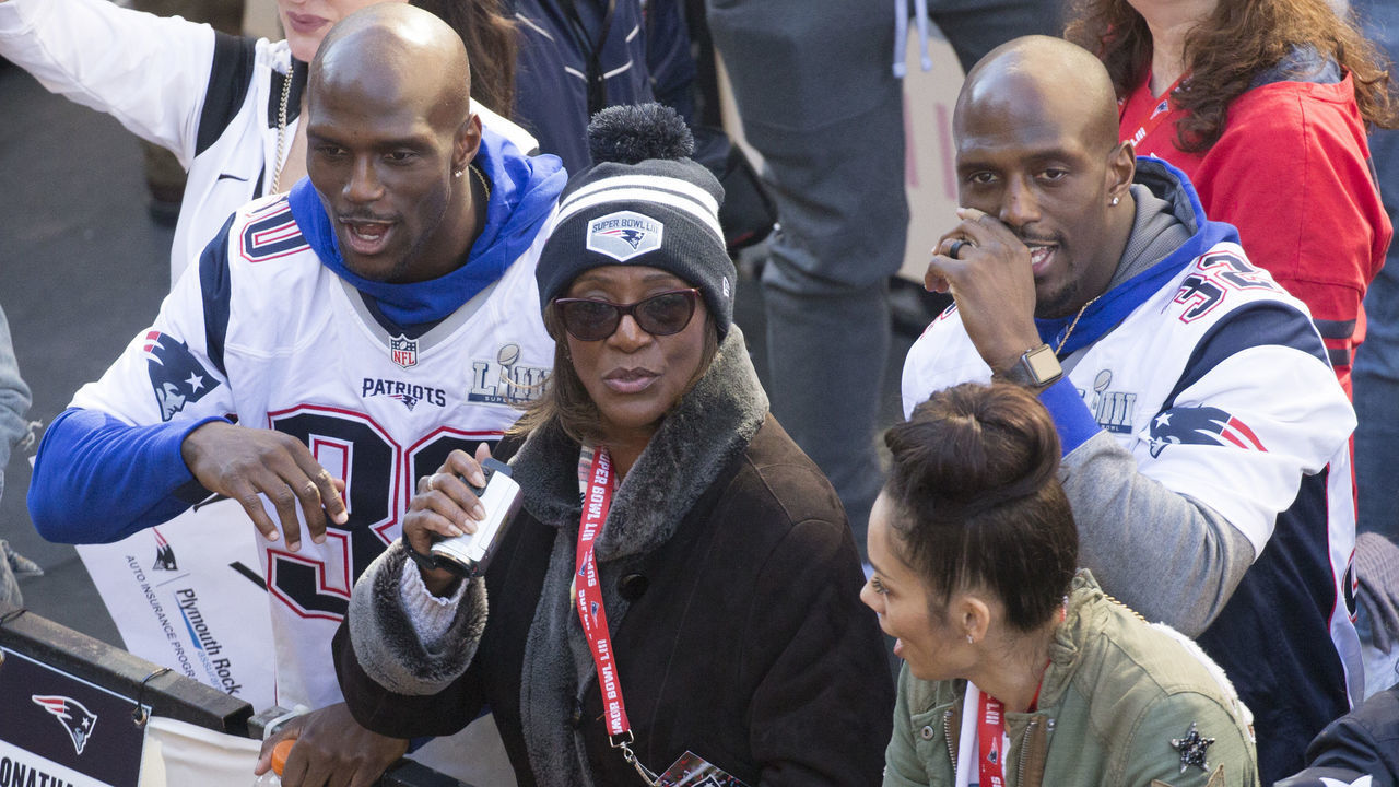 BOSTON, MA - February 4, 2019: New England Patriots Jason, left, and Devin McCourty are joined by their mother Phyllis Harrell, center, during the New England Patriots Super Bowl LIII rolling rally victory parade on Tuesday, February 5, 2019 in Boston, Massachusetts. (Staff photo By Nicolaus Czarnecki/MediaNews Group/Boston Herald)