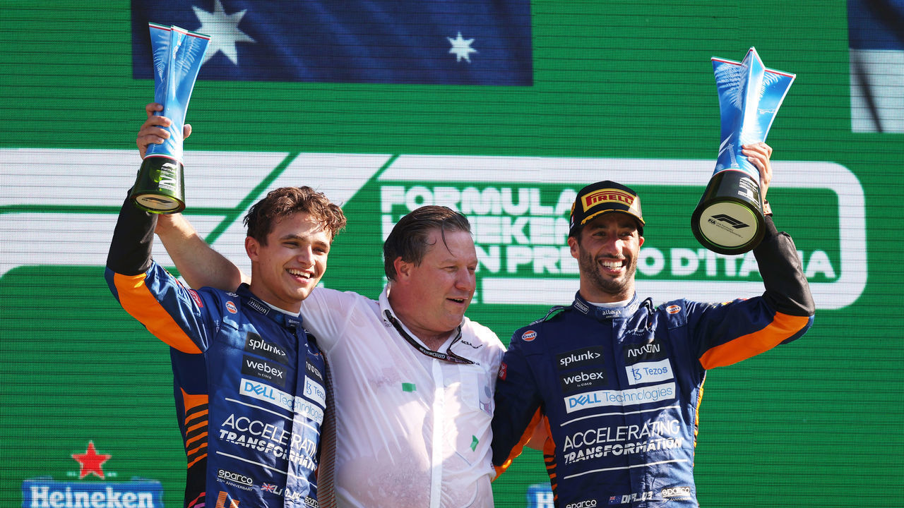 MONZA, ITALY - SEPTEMBER 12: Race winner Daniel Ricciardo of Australia and McLaren F1, second placed Lando Norris of Great Britain and McLaren F1 and McLaren Chief Executive Officer Zak Brown celebrate on the podium during the F1 Grand Prix of Italy at Autodromo di Monza on September 12, 2021 in Monza, Italy.