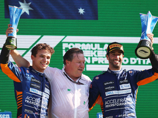 MONZA, ITALY - SEPTEMBER 12: Race winner Daniel Ricciardo of Australia and McLaren F1, second placed Lando Norris of Great Britain and McLaren F1 and McLaren Chief Executive Officer Zak Brown celebrate on the podium during the F1 Grand Prix of Italy at Autodromo di Monza on September 12, 2021 in Monza, Italy.