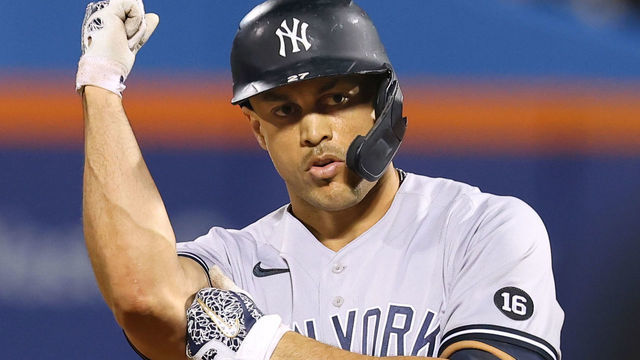 NEW YORK, NY - SEPTEMBER 12: Giancarlo Stanton #27 of the New York Yankees gestures after he hit an RBI double against the New York Mets during the first inning of a game at Citi Field on September 12, 2021 in New York City.