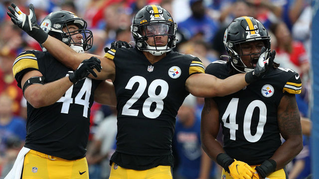 ORCHARD PARK, NEW YORK - SEPTEMBER 12: Derek Watt #44, Miles Killebrew #28, and Jamir Jones #40 of the Pittsburgh Steelers celebrate after a returned blocked punt for a touchdown against the Buffalo Bills during the fourth quarter at Highmark Stadium on September 12, 2021 in Orchard Park, New York.