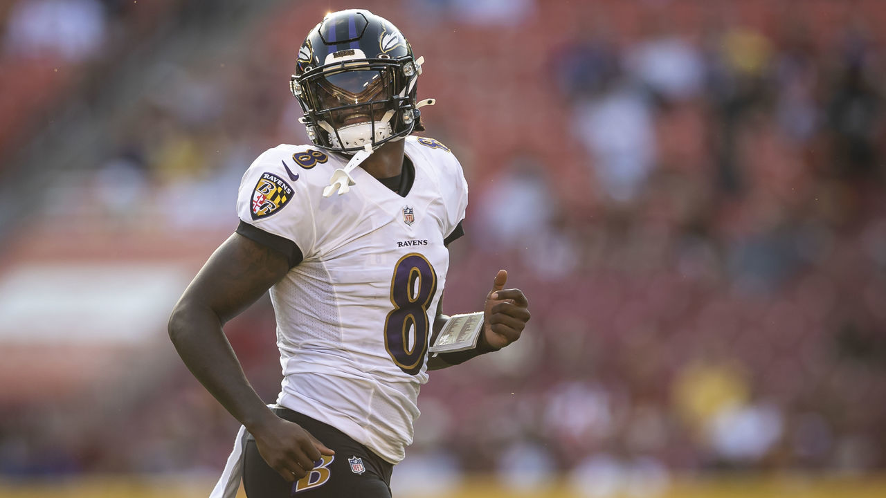 LANDOVER, MD - AUGUST 28: Lamar Jackson #8 of the Baltimore Ravens looks on against the Washington Football Team during the first half of the preseason game at FedExField on August 28, 2021 in Landover, Maryland.