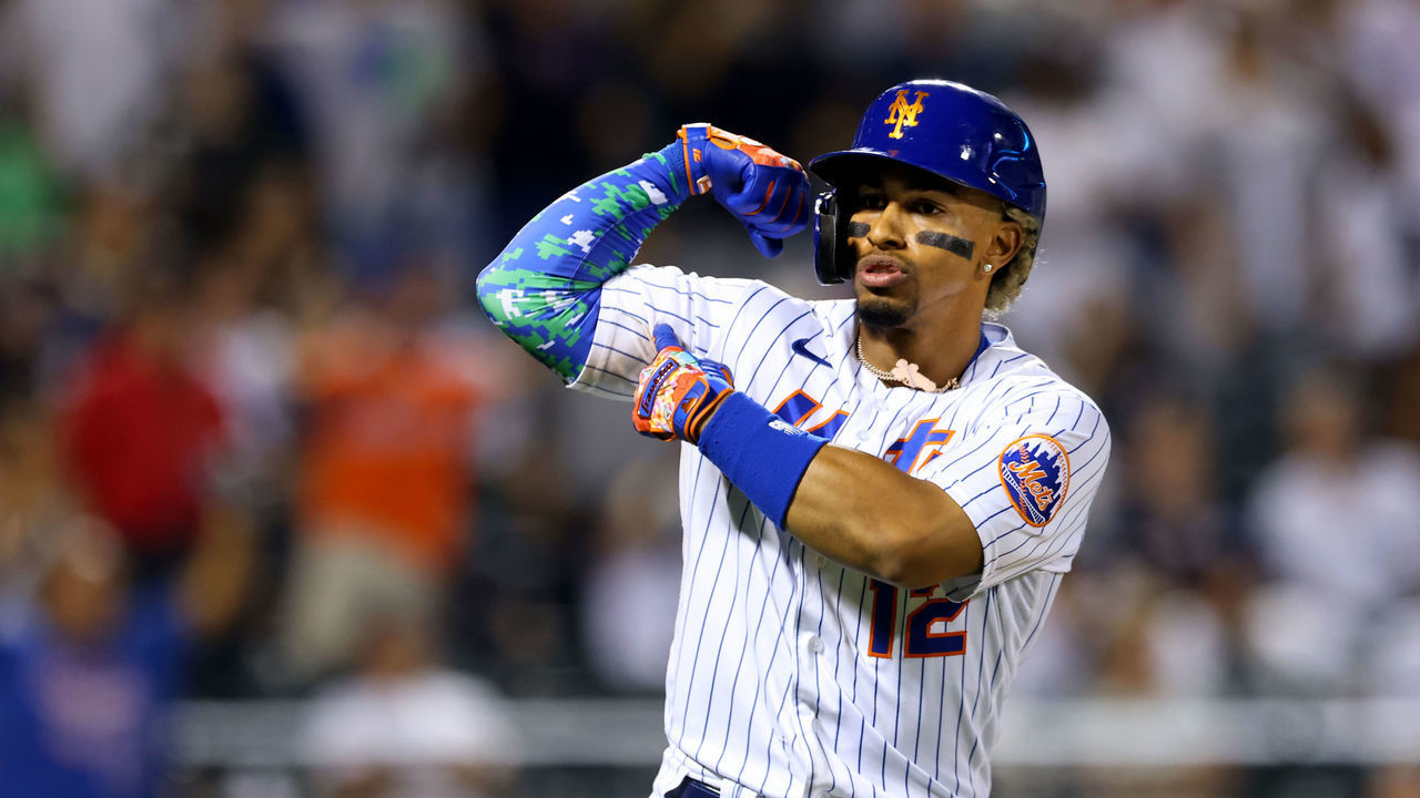 NEW YORK, NY - SEPTEMBER 12: Francisco Lindor #12 of the New York Mets gestures after he hits a home run against the New York Yankees during the eighth inning of a game at Citi Field on September 12, 2021 in New York City. The Mets defeated the Yankees 7-6 as Lindor hit three home runs.