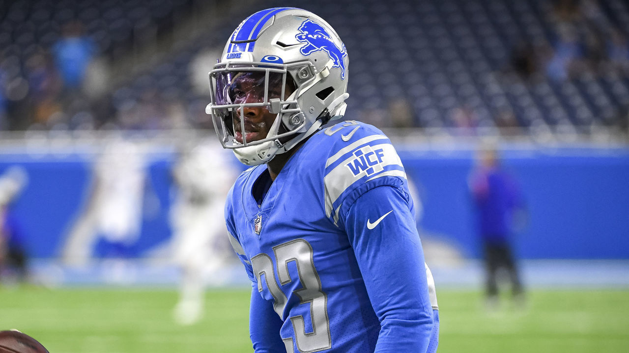 DETROIT, MICHIGAN - AUGUST 13: Jeff Okudah #23 of the Detroit Lions throws a ball before the preseason game against the Buffalo Bills at Ford Field on August 13, 2021 in Detroit, Michigan.