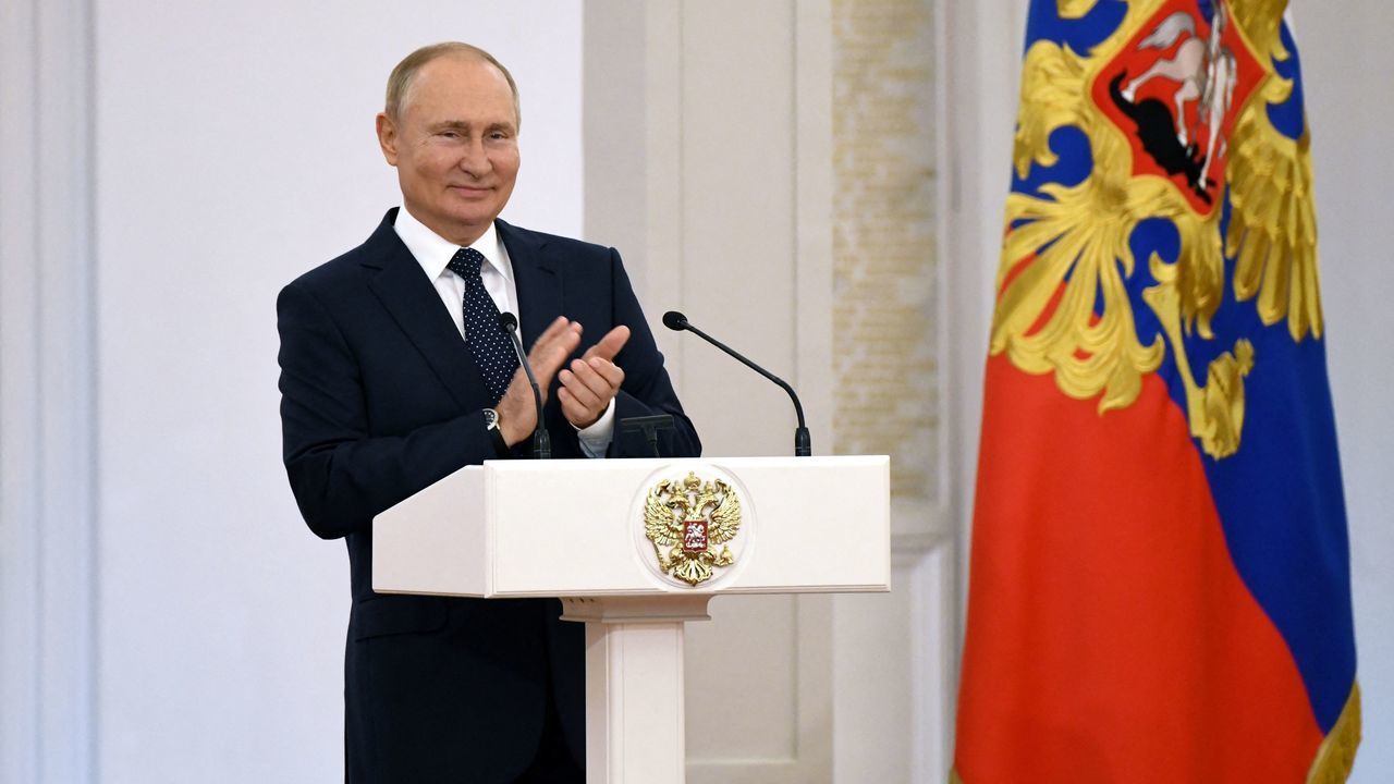 Russia's President Vladimir Putin applauds as he meets with Russian Paralympians, participants of the Tokyo 2020 Paralympic Games at the Kremlin in Moscow on September 13, 2021.