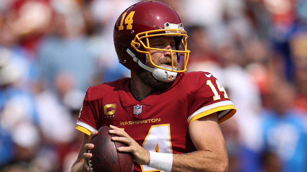 LANDOVER, MARYLAND - SEPTEMBER 12: Ryan Fitzpatrick #14 of the Washington Football Team looks to pass during the game against the Los Angeles Chargers at FedExField on September 12, 2021 in Landover, Maryland.