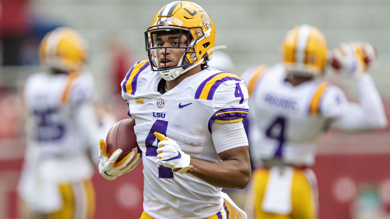 FAYETTEVILLE, AR - NOVEMBER 21: John Emery Jr. #4 of the LSU Tigers warms up before a game against the Arkansas Razorbacks at Razorback Stadium on November 21, 2020 in Fayetteville, Arkansas. The Tigers defeated the Razorbacks 27-24.