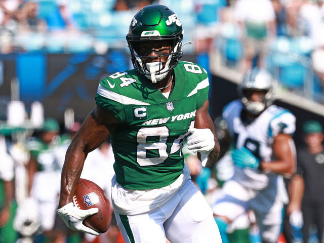 CHARLOTTE, NORTH CAROLINA - SEPTEMBER 12: Corey Davis #84 of the New York Jets runs with the ball after a reception against the Carolina Panthers during the second half at Bank of America Stadium on September 12, 2021 in Charlotte, North Carolina.
