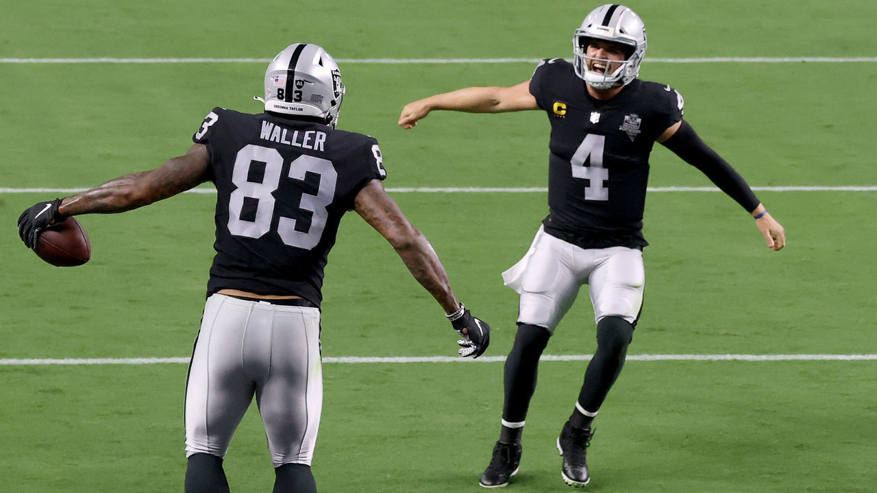 LAS VEGAS, NEVADA - SEPTEMBER 21: Darren Waller #83 of the Las Vegas Raiders celebrates a touchdown with Derek Carr #4 during the third quarter against the New Orleans Saints at Allegiant Stadium on September 21, 2020 in Las Vegas, Nevada.