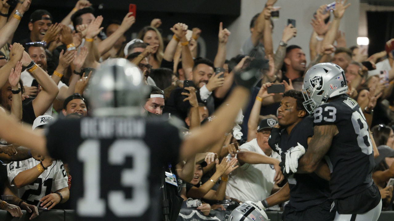 LAS VEGAS, NEVADA - SEPTEMBER 13: Zay Jones #7 of the Las Vegas Raiders celebrates with Darren Waller #83 after scoring the game winning touchdown in overtime to defeat the Baltimore Ravens 33-27 at Allegiant Stadium on September 13, 2021 in Las Vegas, Nevada.