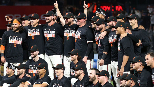 SAN FRANCISCO, CALIFORNIA - SEPTEMBER 13: The San Francisco Giants pose for a team photo on the field after they clinched a playoff birth by beating the San Diego Padres at Oracle Park on September 13, 2021 in San Francisco, California.