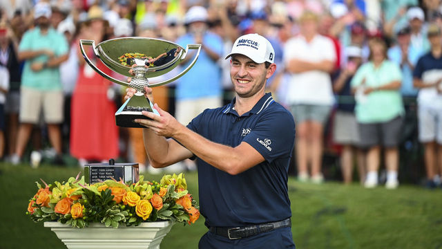 ATLANTA, GA - SEPTEMBER 05: Patrick Cantlay smiles with the FedExCup trophy after his one stroke victory in the final round of the TOUR Championship, the final event of the FedExCup Playoffs, at East Lake Golf Club on September 5, 2021 in Atlanta, Georgia.