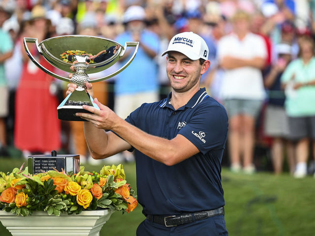 ATLANTA, GA - SEPTEMBER 05: Patrick Cantlay smiles with the FedExCup trophy after his one stroke victory in the final round of the TOUR Championship, the final event of the FedExCup Playoffs, at East Lake Golf Club on September 5, 2021 in Atlanta, Georgia.