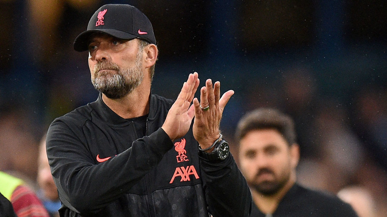 Liverpool's German manager Jurgen Klopp applauds the supporters at the end of the match during the English Premier League football match between Leeds United and Liverpool at Elland Road in Leeds, northern England on September 12, 2021. - RESTRICTED TO EDITORIAL USE. No use with unauthorized audio, video, data, fixture lists, club/league logos or 'live' services. Online in-match use limited to 120 images. An additional 40 images may be used in extra time. No video emulation. Social media in-match use limited to 120 images. An additional 40 images may be used in extra time. No use in betting publications, games or single club/league/player publications.