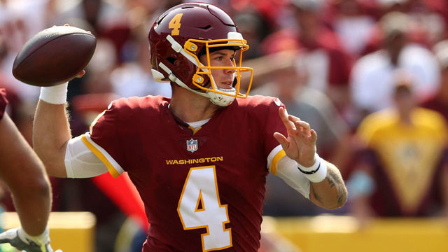 LANDOVER, MARYLAND - SEPTEMBER 12: Taylor Heinicke #4 of the Washington Football Team throws a pass against the Los Angeles Chargers during the third quarter at FedExField on September 12, 2021 in Landover, Maryland.
