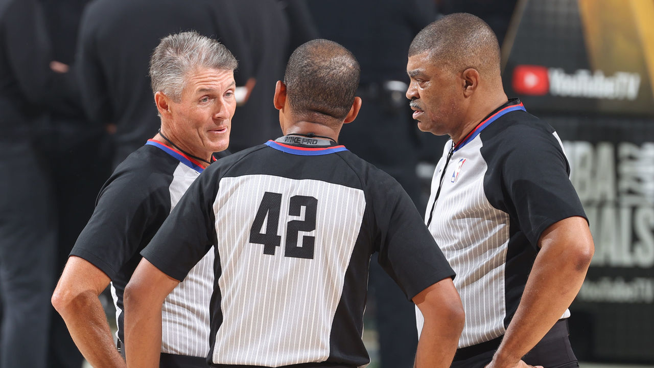 MILWAUKEE, WI - JULY 20: NBA referee Scott Foster #48, referee Eric Lewis #42 and referee Tony Brothers #25 talk during the game between the Phoenix Suns and the Milwaukee Bucks during Game Six of the 2021 NBA Finals on July 20, 2021 at the Fiserv Forum in Milwaukee, Wisconsin. Mandatory Copyright Notice: Copyright 2021 NBAE .