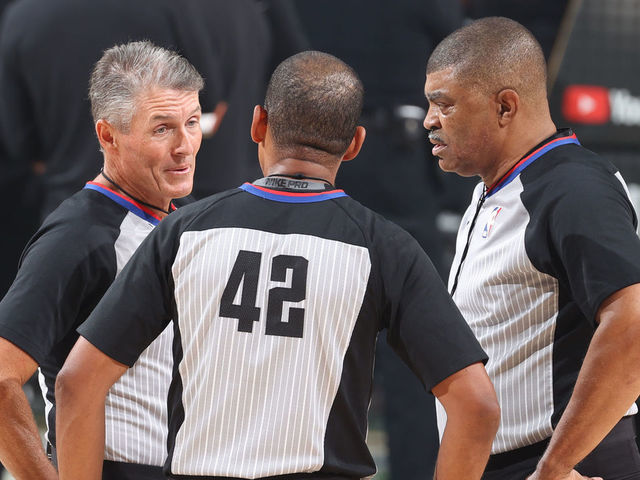MILWAUKEE, WI - JULY 20: NBA referee Scott Foster #48, referee Eric Lewis #42 and referee Tony Brothers #25 talk during the game between the Phoenix Suns and the Milwaukee Bucks during Game Six of the 2021 NBA Finals on July 20, 2021 at the Fiserv Forum in Milwaukee, Wisconsin. Mandatory Copyright Notice: Copyright 2021 NBAE .