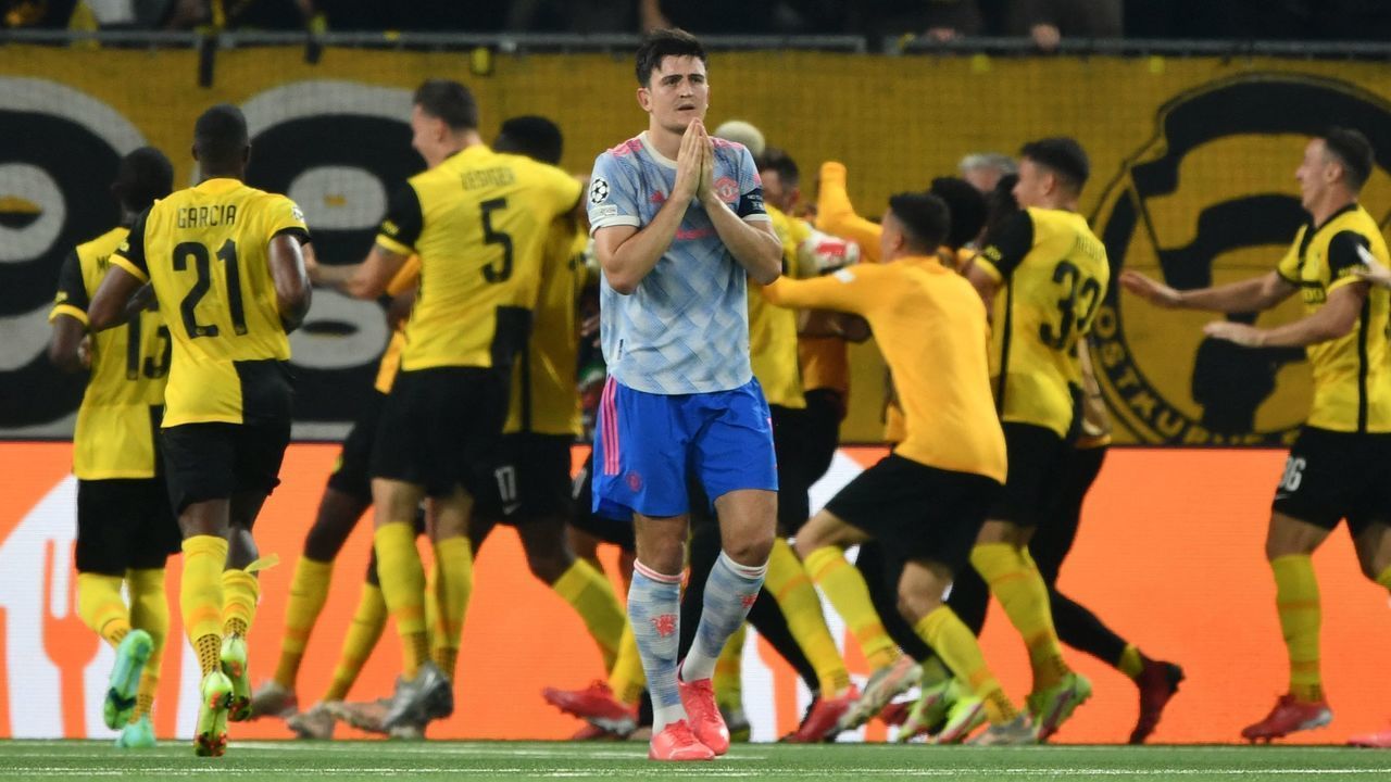 Manchester United's English defender Harry Maguire (C) reacts after Young Boys' US forward Jordy Siebatcheu Pefok (unseen) scored a goal during the UEFA Champions League Group F football match between Young Boys and Manchester United at Wankdorf stadium in Bern, on September 14, 2021.