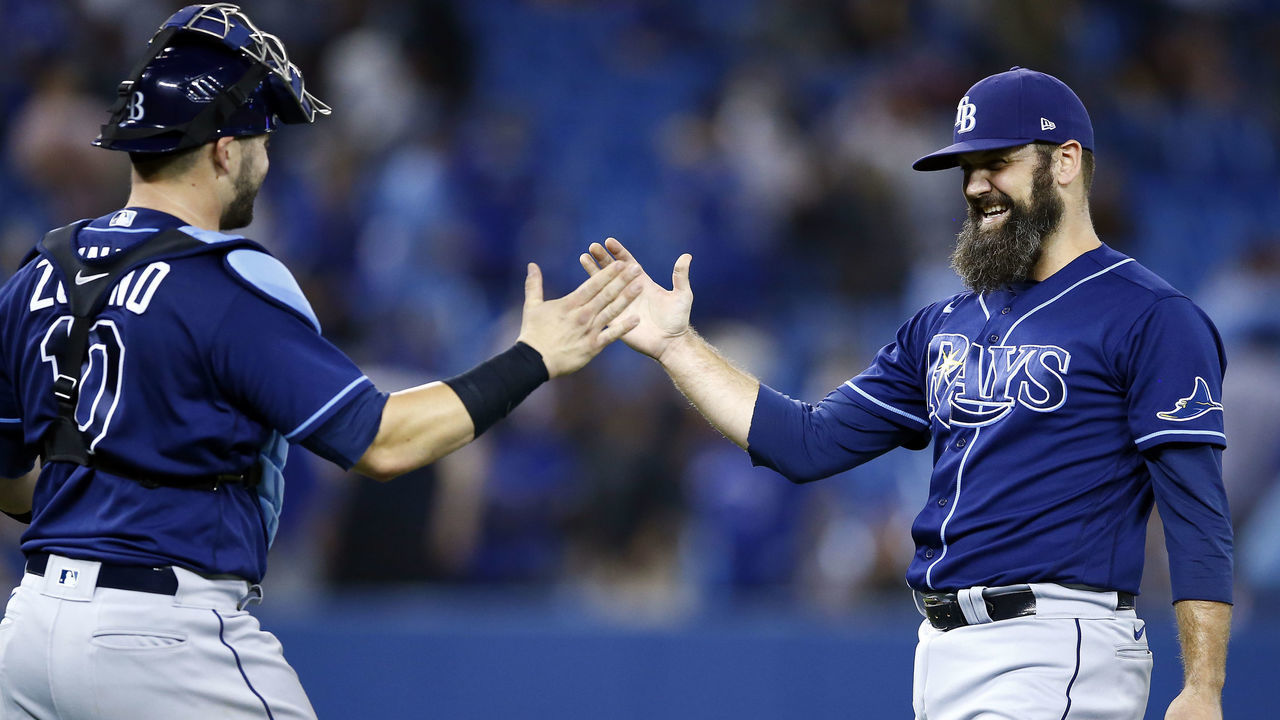 TORONTO, ON - SEPTEMBER 14: Andrew Kittredge #36 of the Tampa Bay Rays celebrate the win with catcher Mike Zunino #10 following a MLB game against the Toronto Blue Jays at Rogers Centre on September 14, 2021 in Toronto, Ontario, Canada.