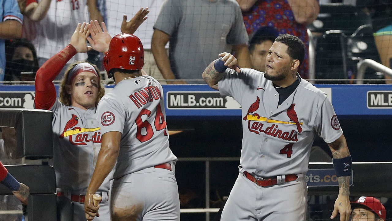 NEW YORK, NEW YORK - SEPTEMBER 14: Edmundo Sosa #63 and Jose Rondon #64 of the St. Louis Cardinals celebrate with teammates Yadier Molina #4 and Harrison Bader #48 after both scored in the eleventh inning against the New York Mets at Citi Field on September 14, 2021 in New York City.