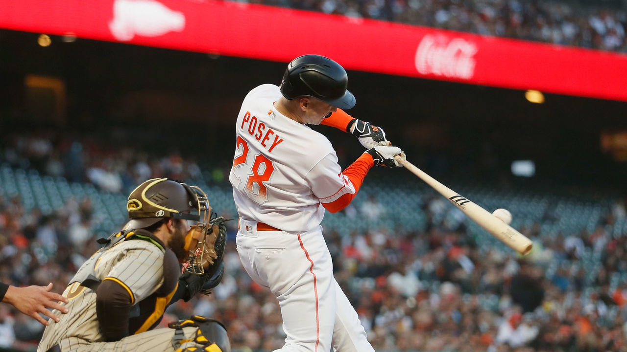 SAN FRANCISCO, CALIFORNIA - SEPTEMBER 14: Buster Posey #28 of the San Francisco Giants hits a solo home run in the bottom of the first inning against the San Diego Padres at Oracle Park on September 14, 2021 in San Francisco, California.