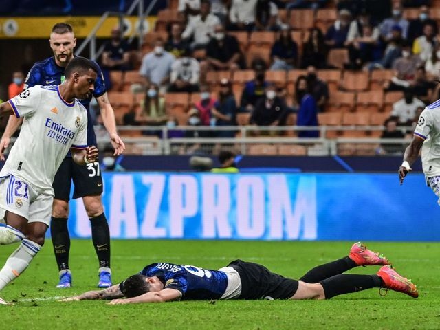 Real Madrid's Brazilian forward Rodrygo (L) celebrates after opening the scoring during the UEFA Champions League Group D football match between Inter Milan and Real Madrid on September 15, 2021 at the San Siro stadium in Milan.