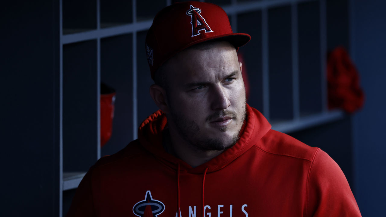 LOS ANGELES, CALIFORNIA - AUGUST 06: Mike Trout #27 of the Los Angeles Angels looks on in the dugout prior to a game against the Los Angeles Dodgers at Dodger Stadium on August 06, 2021 in Los Angeles, California.