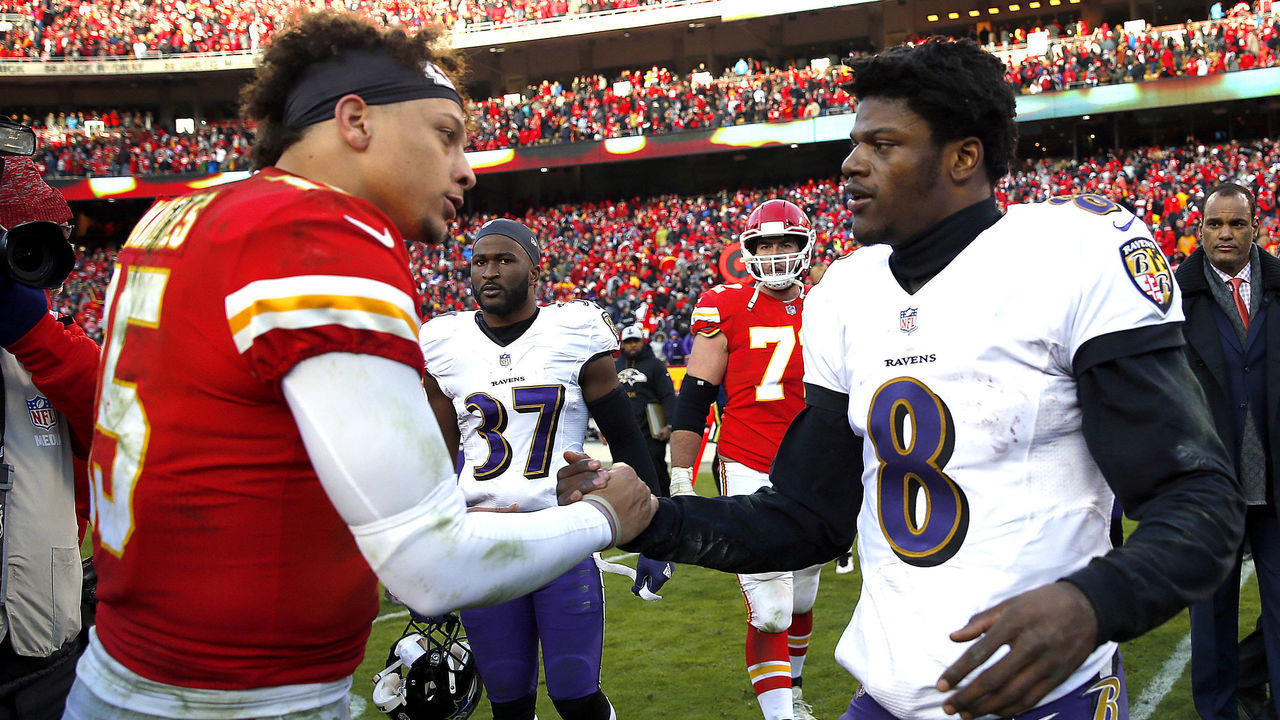KANSAS CITY, MISSOURI - DECEMBER 09: Quarterback Patrick Mahomes #15 of the Kansas City Chiefs shakes hands with quarterback Lamar Jackson #8 of the Baltimore Ravens after the Chiefs defeated the Ravens 27-24 in overtime to win the game at Arrowhead Stadium on December 09, 2018 in Kansas City, Missouri.