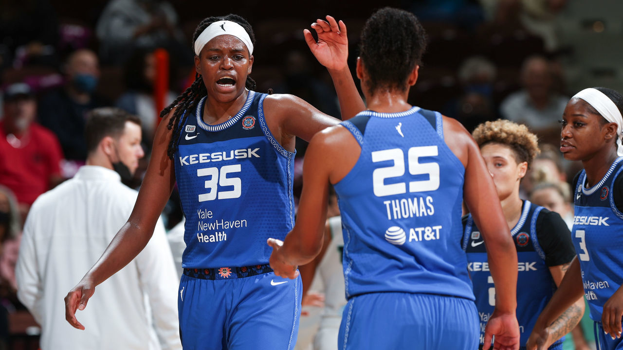 UNCASVILLE, CT - SEPTEMBER 15: Jonquel Jones #35 of the Connecticut Sun high fives Alyssa Thomas #25 of the Connecticut Sun during the game against the New York Liberty on September 15, 2021 at Mohegan Sun Arena in Uncasville, Connecticut. Mandatory Copyright Notice: Copyright 2021 NBAE