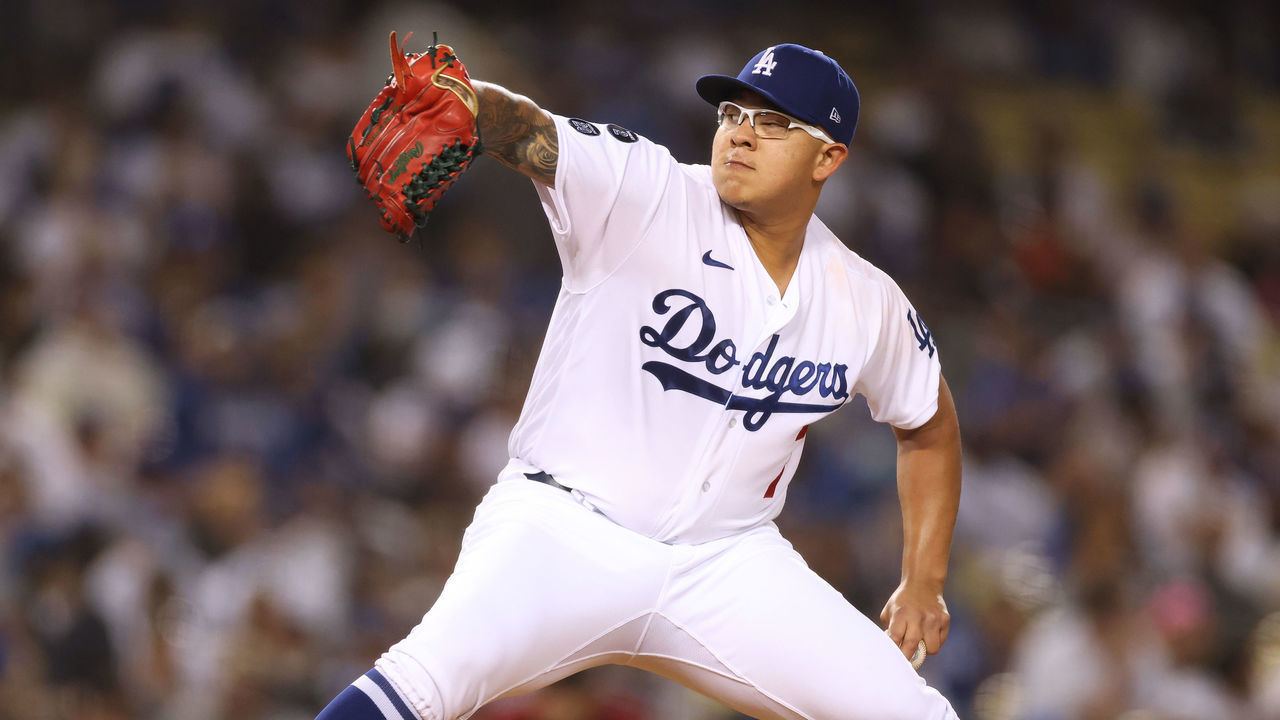 LOS ANGELES, CALIFORNIA - SEPTEMBER 15: Julio Urias #7 of the Los Angeles Dodgers pitches against the Arizona Diamondbacks during the second inning at Dodger Stadium on September 15, 2021 in Los Angeles, California.